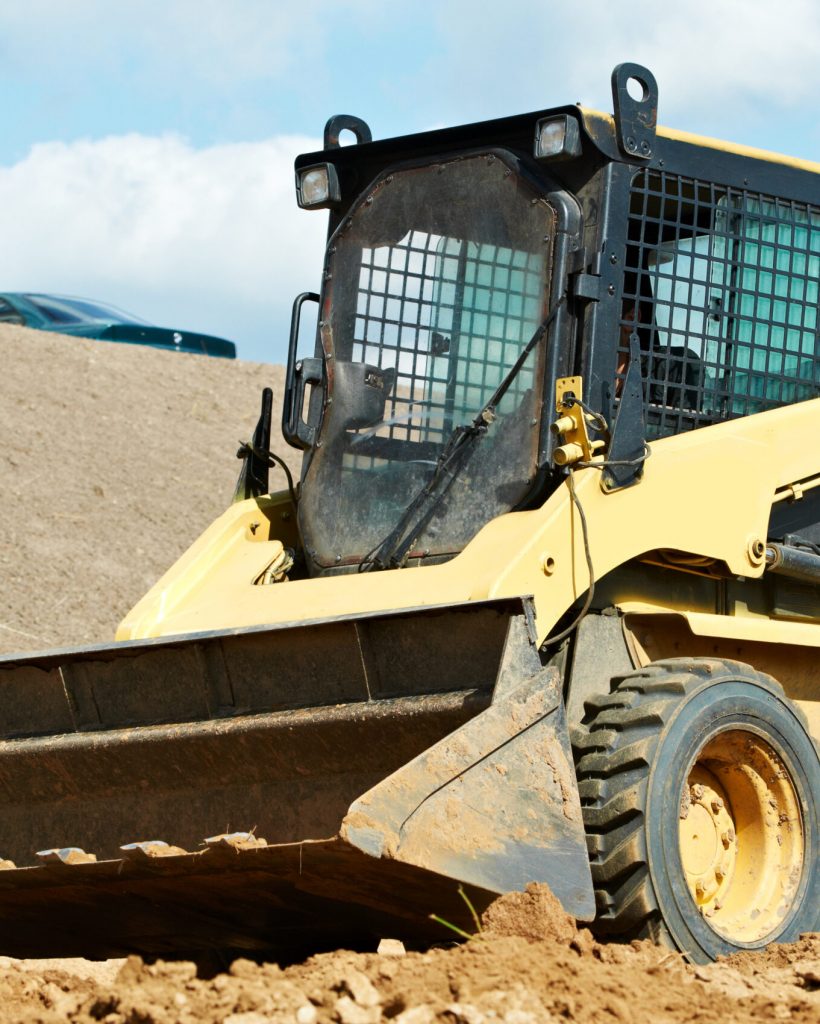 skid steer loader at earth moving works